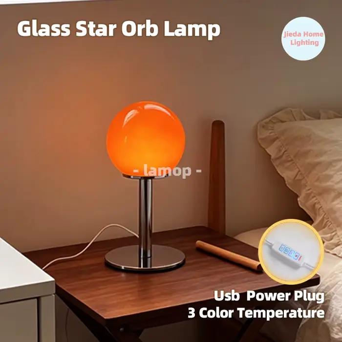 Lampe de table en verre étoile orange brillante